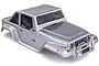A silver pre-painted RC truck body shell designed to look like a Jeep Wrangler, featuring black window decals and HSP branding.