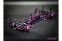A high-angle studio shot of an RC Maker SP1 Hara Limited Edition 1/10 scale touring car chassis featuring purple anodized aluminum and carbon fiber parts.