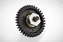 A black plastic spur gear assembly with a central metal hex nut and shaft, isolated on a white background.