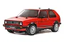 A studio shot of a red Tamiya 1/10 scale RC Volkswagen Golf II GTI model car on a white background.