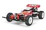 A studio shot of the Tamiya Hotshot 1/10 scale 4WD RC buggy, featuring a red body, white wheels, and off-road tires against a white background.