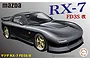 Box art for a Fujimi 1/24 scale Mazda RX-7 FD3S Kai plastic model kit featuring a dark grey modified RX-7 on a grey background.