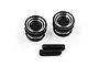 Two black aluminium twist nuts with silver accents and two black grub screws on a white background.