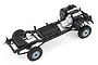 A high-angle studio shot of the Killerbody Mercury 1/10 scale RC crawler chassis, showing the frame, drivetrain, and wheels on a white background.