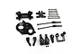 A collection of black anodized aluminium RC car upgrade parts including a motor mount, suspension arms, and drive shafts on a white background.