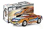 Team Associated RC10 4x4 Rally car kit box and assembled orange and white rally car model on a white background.