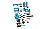 A collection of blue anodized aluminium RC car upgrade parts including suspension arms, hubs, driveshafts, and various screws and bearings.