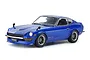 A completed 1/24 scale Tamiya Nissan Fairlady 240Z model car painted in metallic blue with custom fender flares and aftermarket wheels.