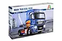 Italeri 1/24 scale MAN TGX XXL D38 truck plastic model kit box showing a blue truck with flame graphics.