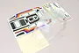 Kyosho 1/10 2014 Beetle clear polycarbonate body shell with included decal sheet on a light background.