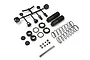 Kyosho Big Bore shock absorber assembly kit including two shock bodies, springs, plastic parts on a sprue, O-rings, and shafts.