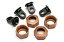 A set of RC shock components including four black plastic shock eyelets and four bronze-coloured metal threaded shock caps.