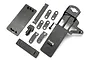 A collection of black plastic radio box parts for an HPI Savage X RC car, including lids, mounts, and a single screw, laid out on a white background.