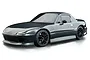 A studio shot of a grey Mazda MX-5 RC drift car body shell on a white background.
