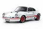 A 1/10 scale Tamiya RC model of a white Porsche 911 Carrera RSR 2.8 with red wheels and red Carrera side decals, shown against a plain white background.