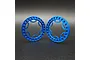 Two blue anodized aluminium beadlock rings for 1.9 inch RC wheels, standing upright on a dark surface.