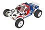 A 1/10 scale Team Associated RC10T stadium truck with a white, red, and blue cow-print racing livery and number 3 decals.