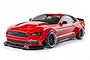 A red MST RMX 2.5 LMBT RC drift car with a Ford Mustang body style, featuring wide fender flares and black wheels, isolated on a white background.