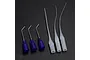 A set of six gluing micro nozzles, including three purple plastic-based metal needles and three flexible clear plastic tips, arranged on a dark surface.