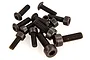 A small pile of black metal socket head cap screws and flat head screws for RC car chassis assembly.