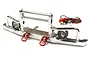 Integy V2 silver aluminium front bumper for RC crawler with integrated LED light buckets, red tow shackles, and a separate LED wiring harness.