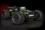 A Traxxas Sledge RC truck in black and green with active LED roof and front bumper lights illuminated against a dark background.