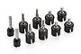 A collection of nine Tamiya RC wheel axle and drive cup assemblies featuring black plastic housings and metal shafts on a white background.