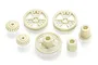 A set of seven off-white plastic RC gears of various sizes and designs arranged on a white background.