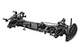 A high-performance 1/10 scale RC Maker SP1-F FWD touring car chassis kit featuring a carbon fibre main deck and bronze-coloured metal components.