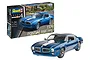 Revell 1/24 scale 1970 Pontiac Firebird plastic model kit box next to a fully assembled and painted blue model car.