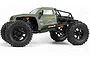 Side view of the HPI Venture 18 green RC rock crawler truck featuring large black off-road tires, orange shock absorbers, and a roll cage.