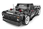 Team Associated Apex2 Hoonitruck RC drift truck in black with Hoonigan branding and white wheels on a white background.