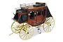 A detailed 1/10 scale wooden model of an 1848 American stagecoach with yellow wheels and a polished wood body.