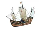 A completed wooden model of the 1492 Spanish La Pinta caravel ship with sails and rigging, set against a plain white background.