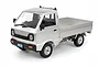 A silver WPL D12 RC Kei truck model, viewed from a high angle against a white background.