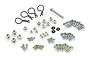 A collection of various metal RC hardware including screws, nuts, body clips, and O-rings arranged on a white background.
