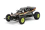 A studio shot of the Tamiya The Grasshopper Black Limited Edition RC buggy, featuring a black body with yellow and red decals and bright yellow wheels.
