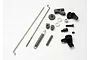 A collection of metal and plastic components for the Traxxas Revo throttle linkage set, including rods, springs, and various small hardware parts.