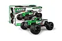Maverick QBit Flux 1/16 scale RC monster truck in green and grey, shown in front of its product packaging box.