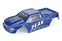 A blue pre-painted RC stadium truck body shell by Atrek, featuring 'PEAK' branding on the side and Atrek logos on the windshield and lower panels.