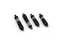 A set of four black RC shock absorbers arranged in a row against a white background.