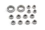 A collection of fourteen metal shielded ball bearings of varying sizes arranged on a white background.
