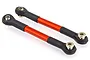 Two orange anodized aluminum RC suspension linkages with black plastic rod ends and metal pivot balls on a white background.