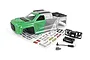 A green and silver painted RC truck body shell for the Maverick 1/16 QBit MT, including a decal sheet, plastic accessories, and small screws.