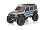 Team Associated RC10 Trail Truck Cattleman 1/10 scale RC rock crawler in silver with racing decals and black off-road tires.