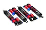 A set of four red and black Integy V2 aluminium piggyback shock absorbers for RC vehicles, arranged on a white background.
