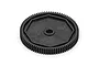 A black plastic spur gear for RC vehicles, featuring a central hole and an octagonal raised detail on the face, isolated on a white background.