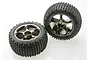 Two Traxxas 2.2 inch Bandit rear Alias tyres mounted on black chrome Tracer rims against a white background.