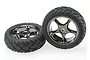 Two Traxxas 2.2 inch Anaconda front tires mounted on black chrome Tracer wheels, shown against a white background.