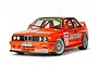 A 1/10 scale Tamiya RC model of a 1992 BMW M3 Sport EVO in iconic orange Jägermeister racing livery, shown from a front three-quarter angle.